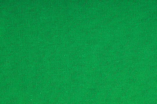 green fabric textile material as texture or background