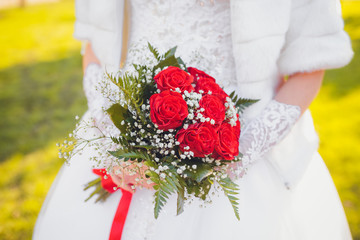 wedding bouquet in hands of the brid
