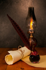 Feather pen with ink, scroll and kerosene lamp - 63513477