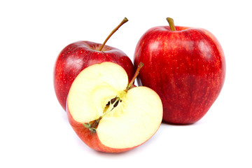 Fresh red apples with a slice on white background.