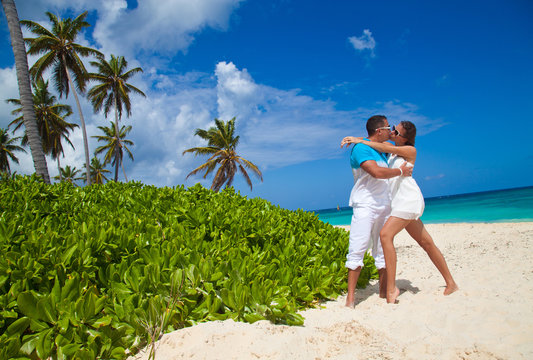 Loving couple on tropical beach