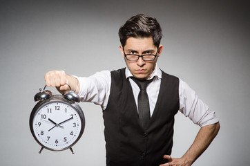 Businessman with clock in time concept