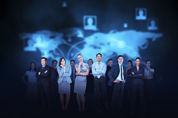 Business team against blue map background