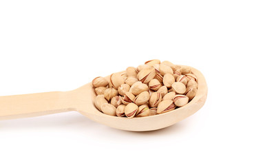 Wooden spoon with pistachios