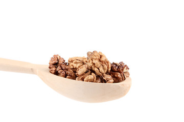 Wooden spoon full with walnuts