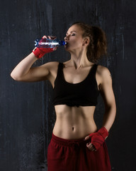 sporty woman drinking