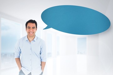 Composite image of smiling casual man standing with speech bubbl