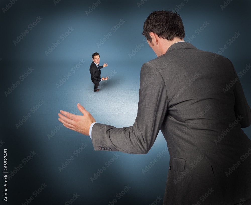 Poster Composite image of businessman posing with hands out with tiny b