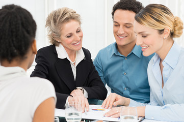 Two Businesswomen Discussing In Meeting