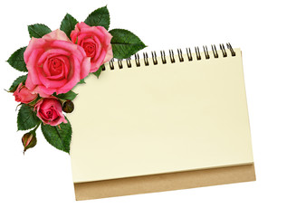 Notebook and rose flowers