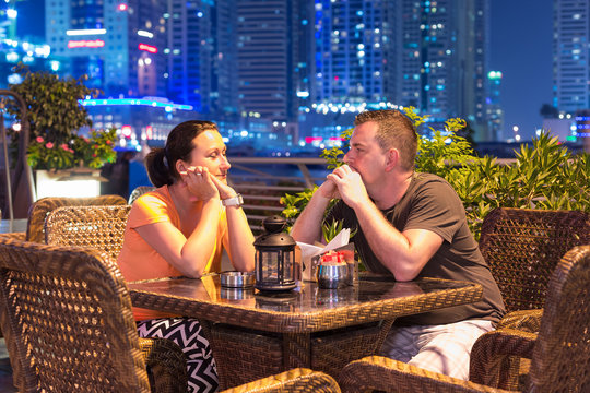 Couple On Romantic Dinner In Dubai Marina At Night