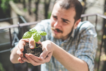 handsome stylish man gardening