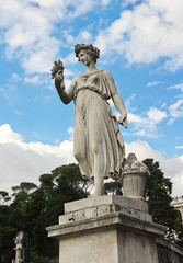 One of the four allegorical sculptures in Piazza del Popolo