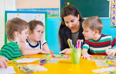 Little children at applique lesson