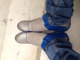 sitting and joined shoes 