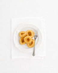 Onion rings on a white background