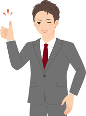 サムズアップするスーツの男性