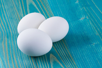 white eggs an blue wood