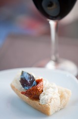 Sliced baguette with dried tomato