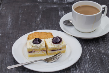 A cup of cafe latte and cake