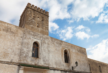 Fototapeta na wymiar Stone walls of old fortress with blue sky. Madina, Tangier, Moro