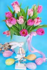 easter decoration with wooden bunny and fresh tulips