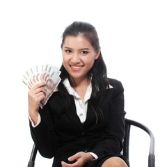 Businesswoman holding Thai banknotes