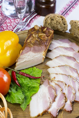 bacon on the table in a restaurant with sauce and vegetables