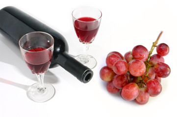 Wine glass and wine bottle with grape isolated