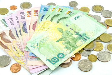 Thailand banknotes and coins isolated on white