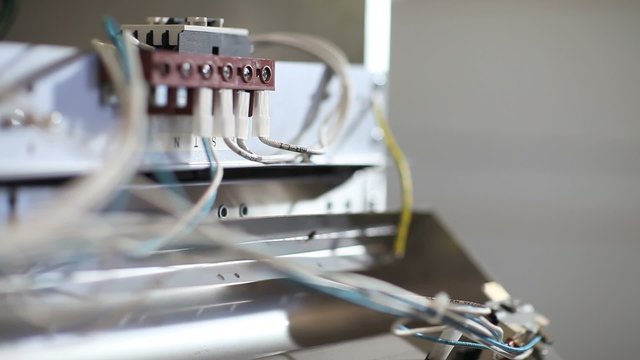 factory worker connecting electrical wires