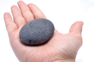 Stone in hand isolated