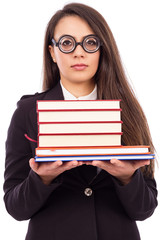 Portrait of a young serious teacher with glasses holding books