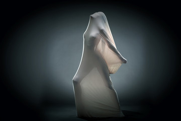 Screaming naked woman trying to escape from tissue