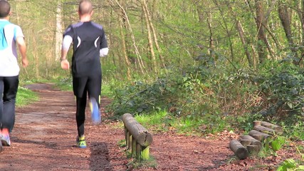 Young man working out in the forrest 