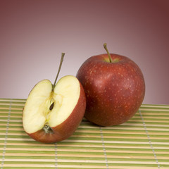 apple on a striped surface closeup