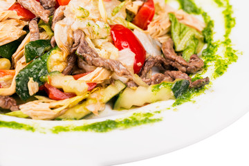 Asian spicy salad with meat, cucumbers and other vegetables