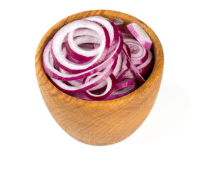 red onion slices in a wooden bowl isolated on white