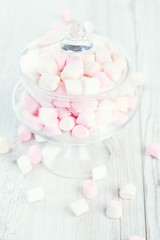 Obraz na płótnie Canvas marshmallows in beautiful glass dish on a wooden table