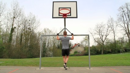 Young man doing pull up