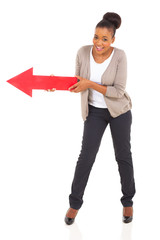 african american woman holding red arrow