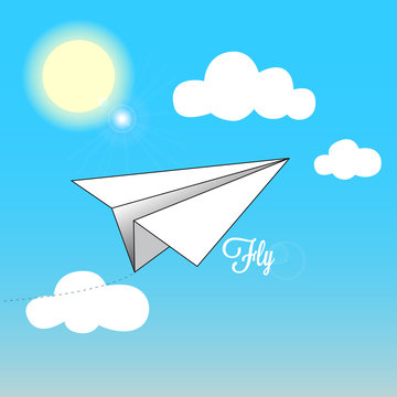 paper airplane flies on a blue sky during a clear sunny day