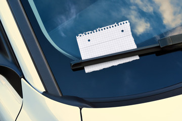 message under a windshield wiper