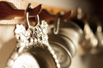 Old pewter dishes hanging on wall
