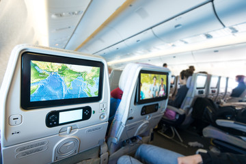 People on board looking at seat monitors.