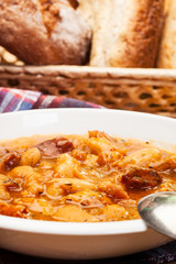 Beans with tomato sauce, bacon and sausage