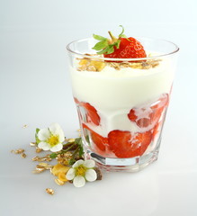Yogurt with strawberry and cereal in glass