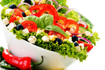 Vegetable salad bowl isolated on white