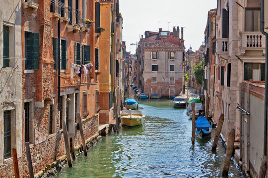 Venice canal with moored boats