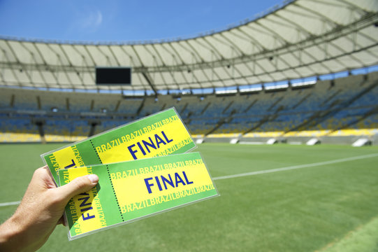 Soccer Fan Holding Two Brazil Final Tickets at the Stadium
